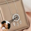 Customizable dreamcatcher necklace projecting a photograph, available in silver, gold, and rose gold.