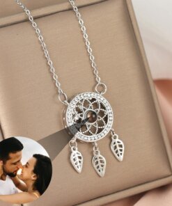 Customizable dreamcatcher necklace projecting a photograph, available in silver, gold, and rose gold.