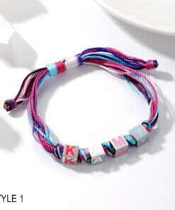 Girls’ bracelet with enamel letter charms in pink, blue, and purple